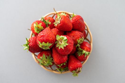 strawberries in a wicker plate.