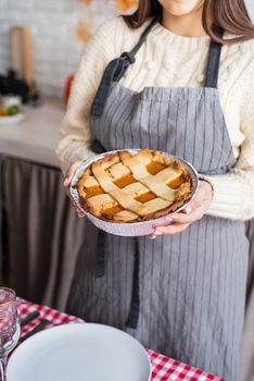 Happy Thanksgiving Day. Autumn feast. Woman celebrating holiday cooking traditional dinner at kitchen