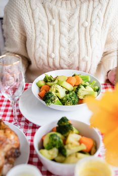 Happy Thanksgiving Day. Autumn feast. Woman celebrating holiday eating traditional dinner at kitchen