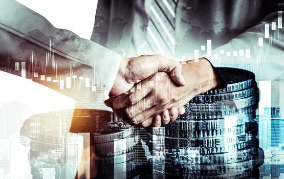 Business handshake on finance prosperity and money technology asset background . Economy and financial growth by investment in valuable stock market to gain wealth profit form currency trading