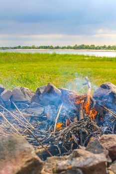 Campfire and burning wood with orange flames on the Harrier Sand island in Schwanewede Osterholz Lower Saxony Germany.