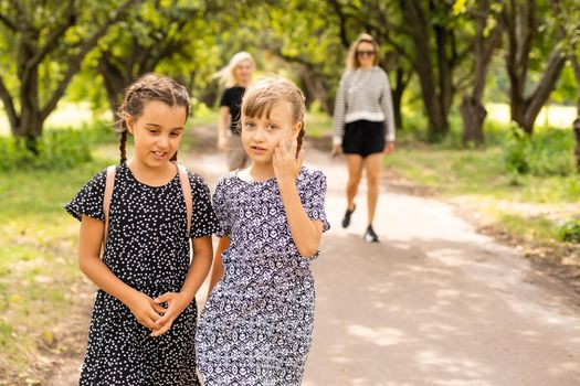 Basic school students crossing the road.