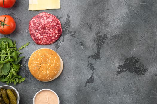 Burger banner. Raw ingredients for burger set, on gray stone background, top view flat lay, with copy space for text