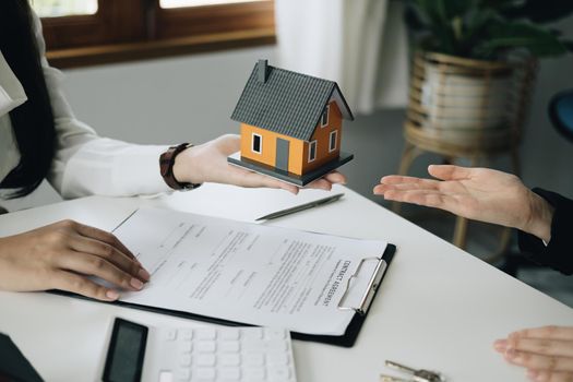 Guarantee, mortgage, agreement, contract, sign, real estate agent delivers the house to the customer after signing important contract documents.