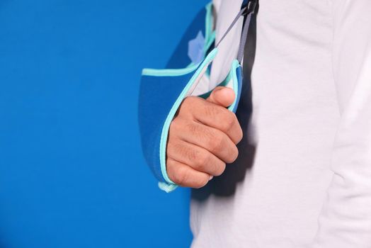 young man wearing an arm brace for broken hand