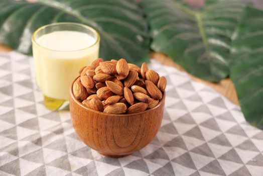 almond nut and milk on table top down.