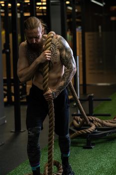 Rope man invisible was tug pull casual force power male, for handsome struggle from rivalry from pulling white, lifestyle fit. ABS activity professional, studio