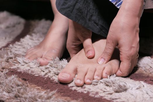 Close up on women feet and hand massage on injury spot
