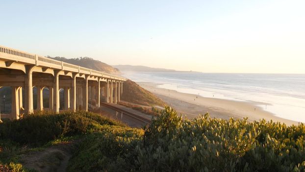 Bridge on pacific coast highway 1, Torrey Pines state beach, Del Mar, San Diego, California USA. Coastal road trip vacations, sunset seat scenic vista view point. Roadtrip on freeway 101 along ocean.