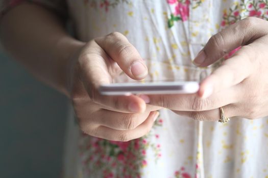 close up of women hand holding smart phone.