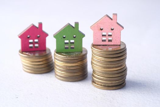 selective focus. the concept of finance concept with stack of coins and house on table .