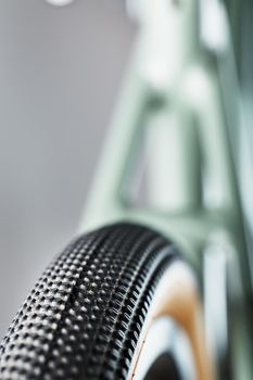 Shallow tread of a bicycle tubeless tire with a brown sidewall close-up