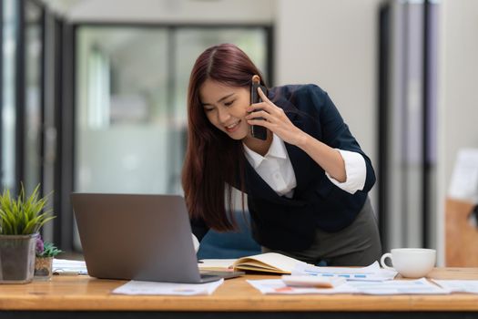 Portrait of Business woman or accountant or banker audit and analysis with financial costs wisely and carefully, investment and saving concept