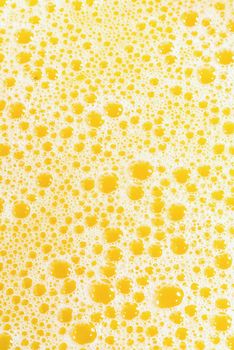 Closeup of splashing orange juice, top view. Splash of fresh sweet orange, mango, fruit juice. Freeze motion of pouring orange juice .