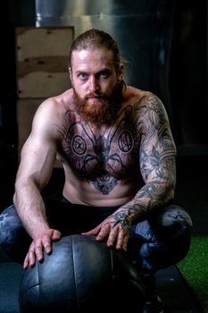 Ball - ups tattoo beard sits push man athletic push caucasian, for athlete training from healthy from handsome energy, male lifestyle. Physical supplement lifting, background