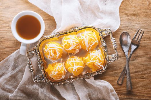 Toddy palm cake or Kanom Tan, Thai traditional dessert. Khanom tan is made from rice flour, ripe sugar palm fruit, coconut milk, scraped coconut, sugar and salt.