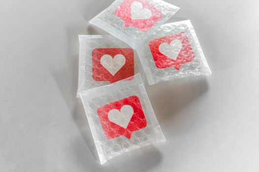 Packaging social symbols and icons with bubble wrap.