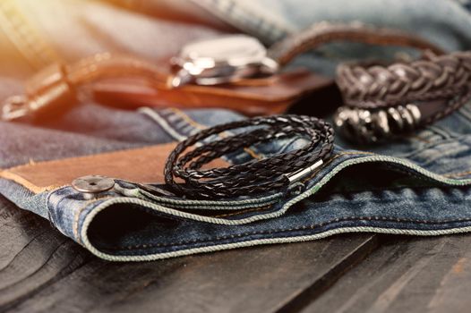 closeup black braided leather bracelet for men, casual style of men accessories. Shallow depth of field.