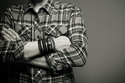 The man wearing bracelets, casual style of men accessories. Shallow depth of field.