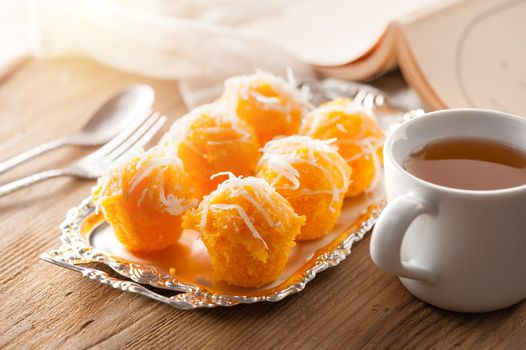 Toddy palm cake or Kanom Tan, Thai traditional dessert. Khanom tan is made from rice flour, ripe sugar palm fruit, coconut milk, scraped coconut, sugar and salt.