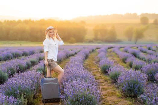 woman with bag in lavender field