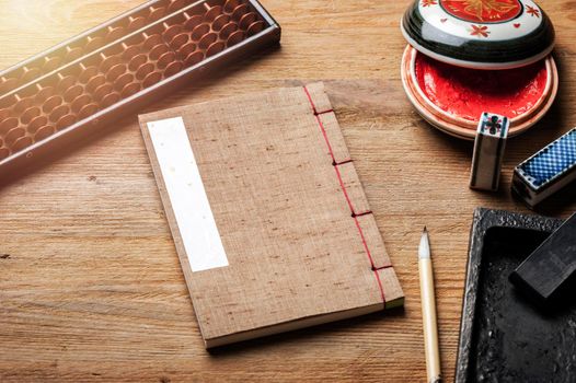 closeup vintage style of Japanese stab binding on wooden desk