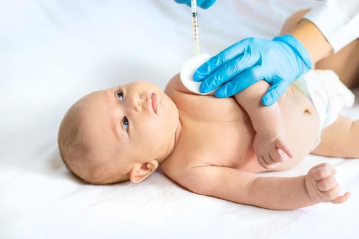 Vaccination baby, injection in the arm. Selective focus. People.