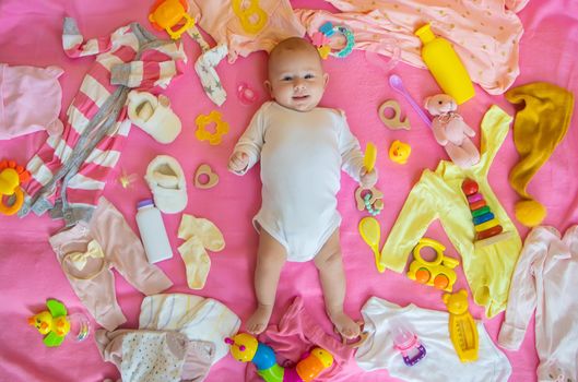 Baby with clothes and accessories. Selective focus. People.
