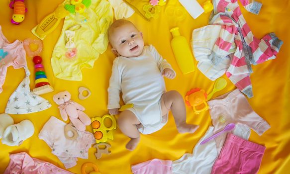 Baby with clothes and accessories. Selective focus. People.