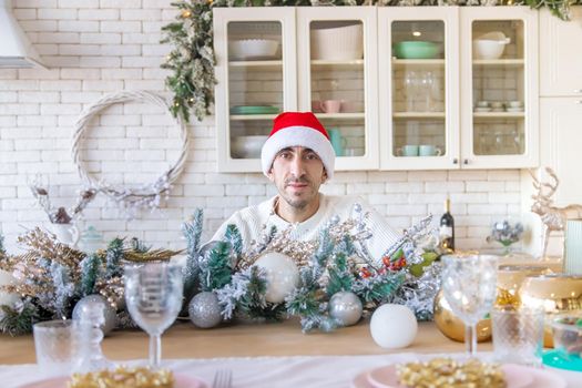 Man in the kitchen Christmas photo. Selective focus.