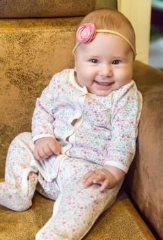 The baby is 4 months old and is being played. Selective focus. people.