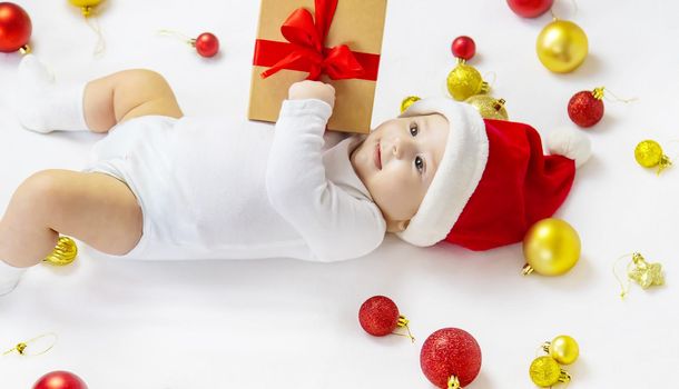 Christmas photo of baby with New Year's decor. selective focus. holiday.