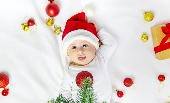 Christmas photo of baby with New Year's decor. selective focus. holiday.