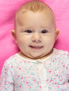 The baby is 4 months old and is being played. Selective focus. people.