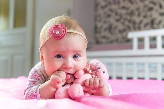 The baby is 4 months old and is being played. Selective focus. people.