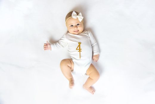 The baby is 4 months old and is being played. Selective focus. people.