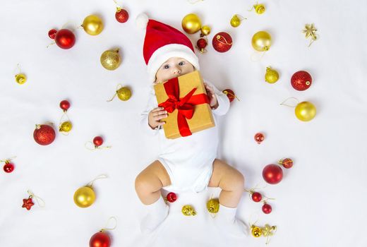 Christmas photo of baby with New Year's decor. selective focus. holiday.