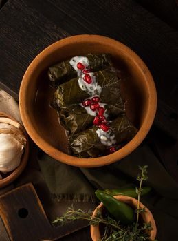 A top view of dolma covered in grape leaves