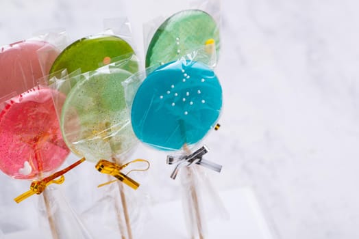 Colorful lollipops on a blurred background