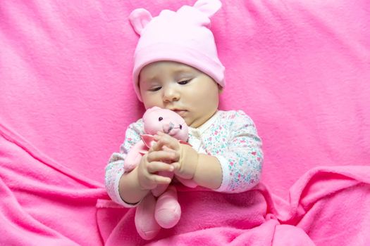 Baby sleeps with a bear. Selective focus. people.