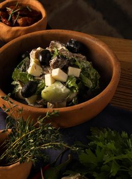 A closeup shot of a gourmet Georgian salad on a restaurant table
