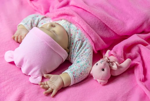 Baby sleeps with a bear. Selective focus. people.