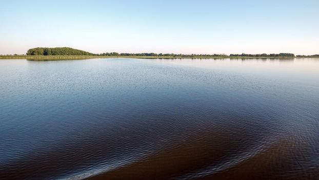 Very large water area and coast in the distance. The concept of peace and relaxation in nature