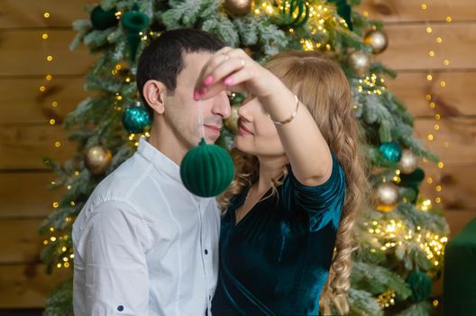 Christmas man and woman hold decoration. Selective focus. Holiday.