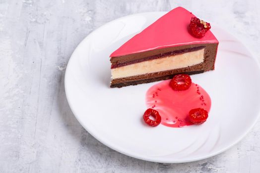 A top view of a slice of tasty cake on white plate