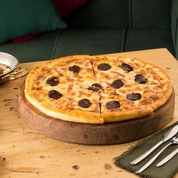 A closeup of freshly-baked pizza on a table