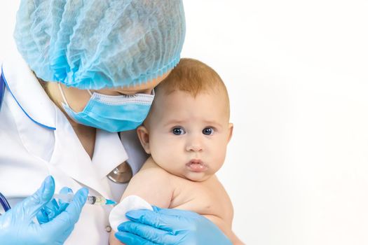 Vaccination of a baby by a doctor in a hospital. Selective focus. medicine.