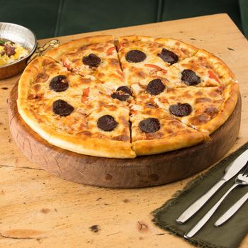 A closeup of freshly-baked pizza on a table