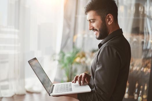 business man reading an email on his laptop . close-up.