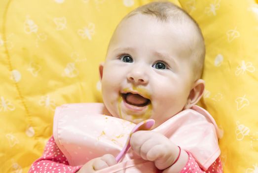 Baby is eating vegetable puree. Selective focus. Food.